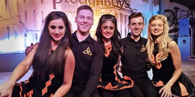 Merry Dance Show performers - pic by Merry Ploughboy Five dancers from the Merry Ploughboy Dance Show posing and smiling